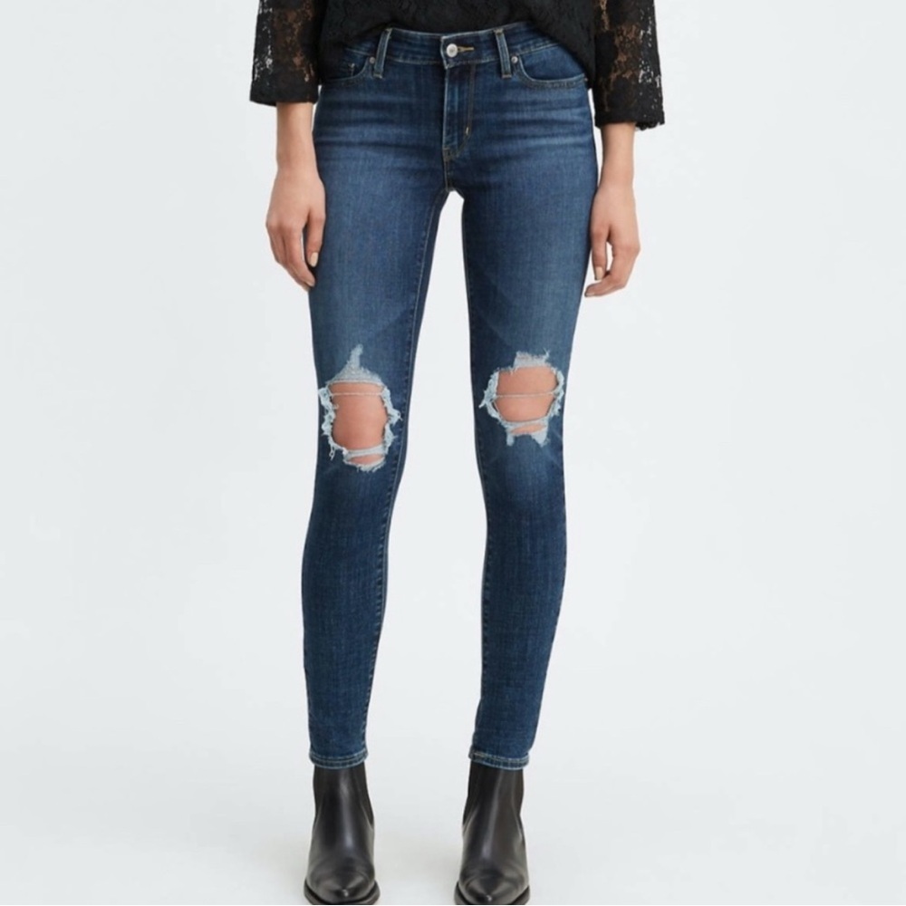 Levi's dark wash Blue 711 Skinny Jeans Distressed Hem & knees 28x30